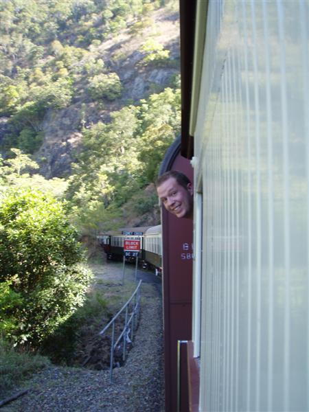 Landers with his head out the train